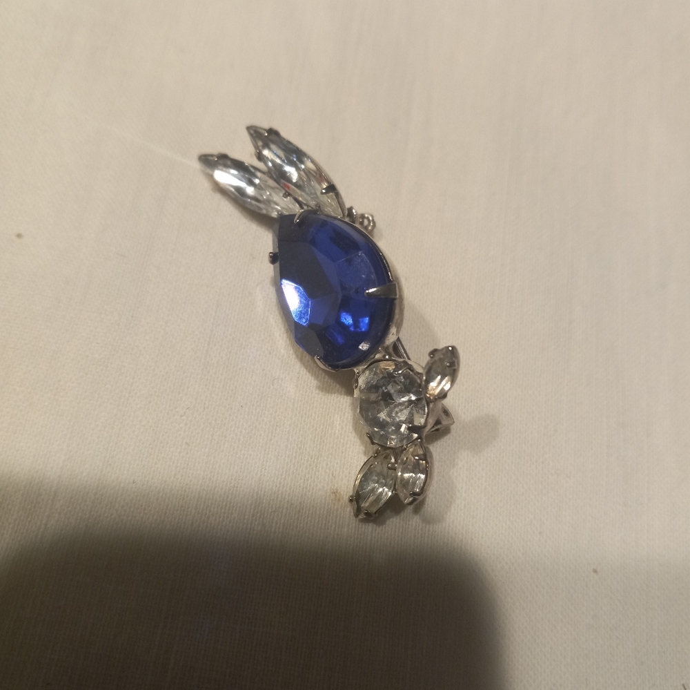 Vintage brooch with large blue stone and smaller clear stones